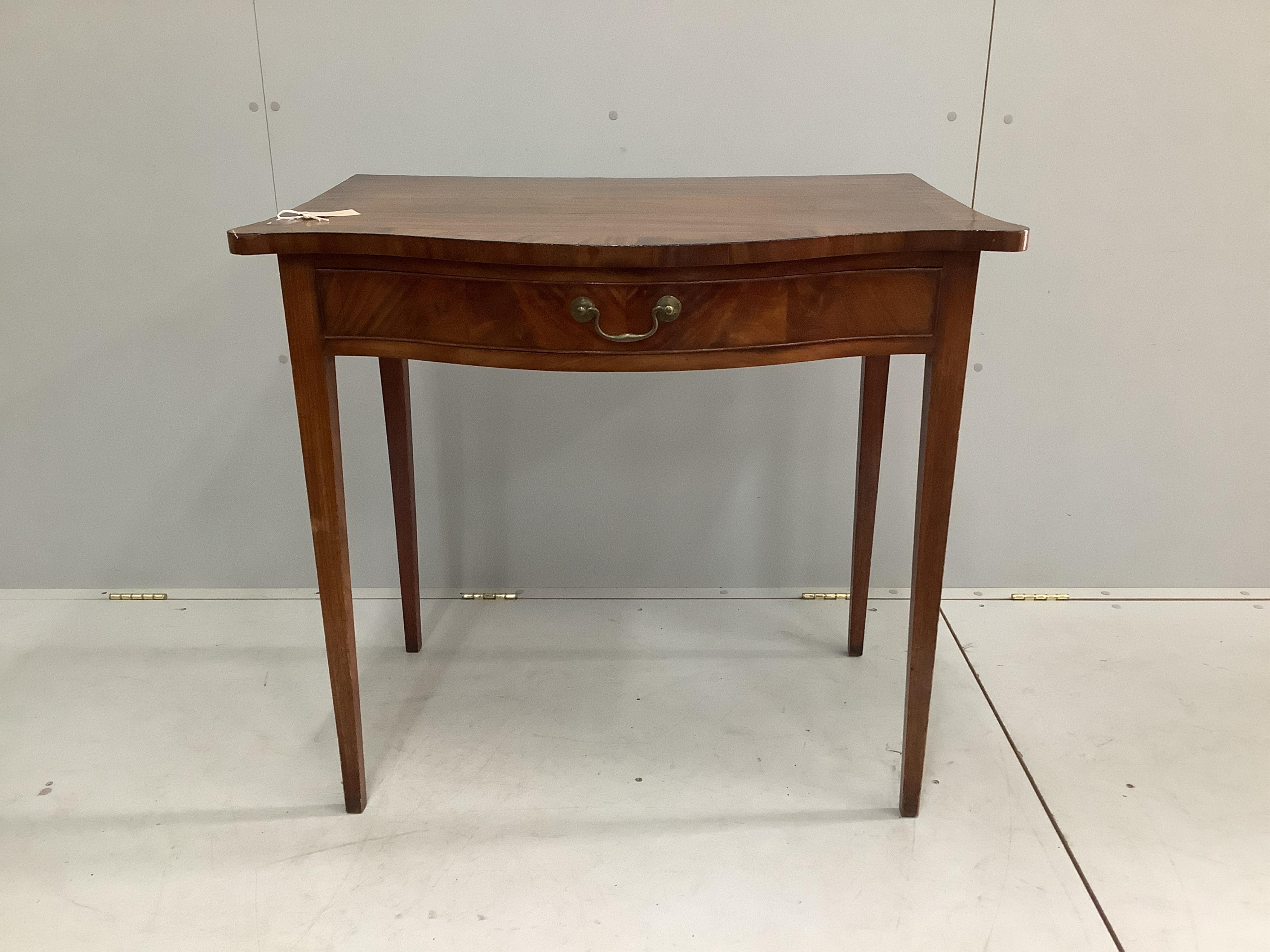 A George III banded mahogany serpentine serving table, width 91cm, depth 58cm, height 82cm. Condition - fair